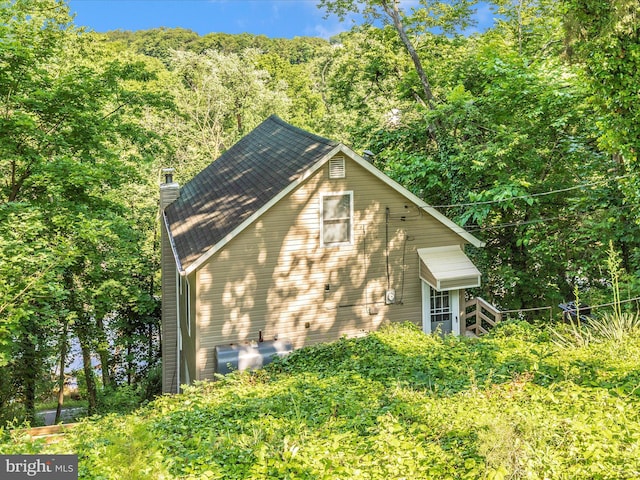 12535 Rockdale Rd, Clear Spring, MD 21722 - view of property exterior with a chimney and a view of trees