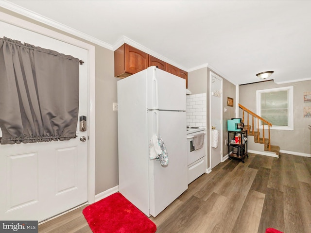 12535 Rockdale Rd, Clear Spring, MD 21722 - kitchen featuring white appliances, wood finished floors, crown molding, brown cabinets, and backsplash