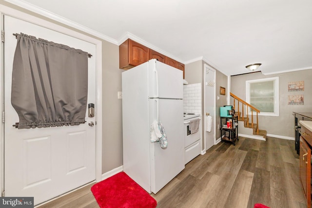 12535 Rockdale Rd, Clear Spring, MD 21722 - kitchen with white appliances, wood finished floors, ornamental molding, and brown cabinetry