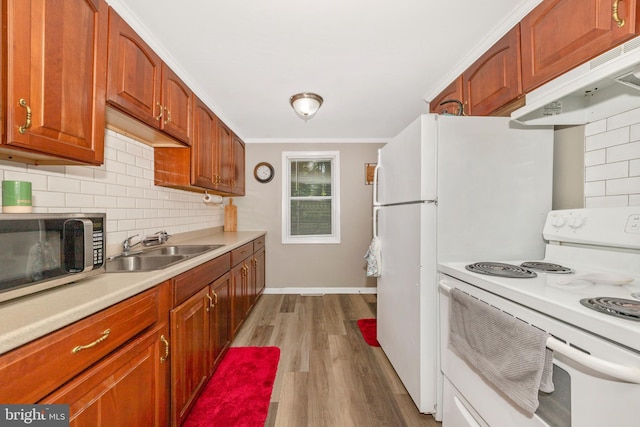 12535 Rockdale Rd, Clear Spring, MD 21722 - kitchen featuring electric range, stainless steel microwave, under cabinet range hood, light countertops, and decorative backsplash