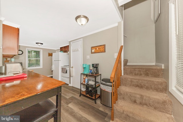 12535 Rockdale Rd, Clear Spring, MD 21722 - kitchen featuring wood finished floors, ornamental molding, and white appliances