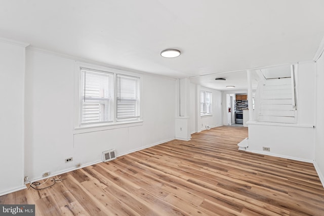 248 S Broadway, Gloucester City, NJ 08030 - unfurnished living room featuring wood finished floors and ornamental molding