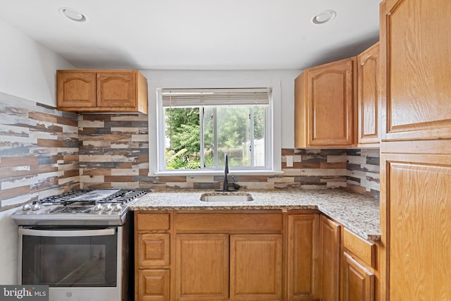 248 S Broadway, Gloucester City, NJ 08030 - kitchen with stainless steel gas stove, light stone counters, tasteful backsplash, and recessed lighting