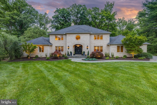 8 Rockland Vue Ct, Towson, MD 21204 - view of front of home featuring a chimney, a lawn, brick siding, and roof with shingles