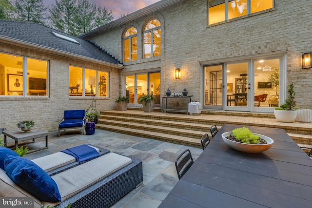 8 Rockland Vue Ct, Towson, MD 21204 - rear view of property featuring a patio, brick siding, and an outdoor hangout area