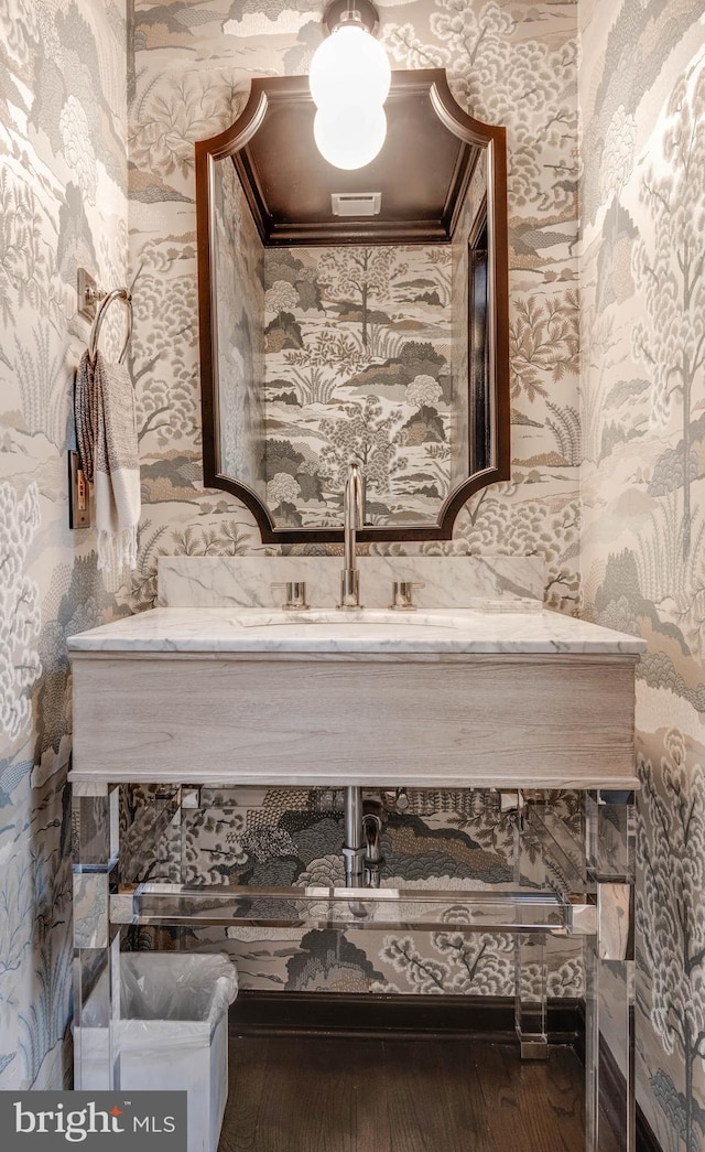 8 Rockland Vue Ct, Towson, MD 21204 - bathroom featuring wallpapered walls, hardwood / wood-style flooring, vanity, and ornamental molding