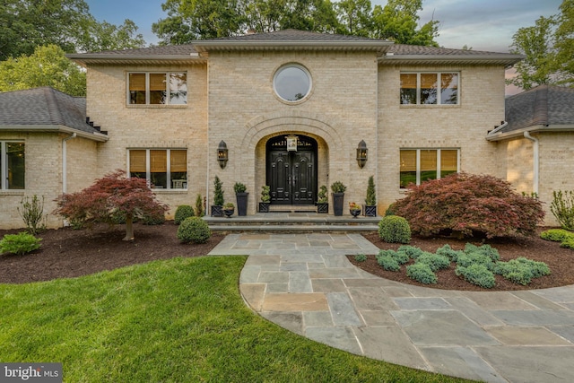 8 Rockland Vue Ct, Towson, MD 21204 - view of front facade with brick siding, a front yard, and a shingled roof