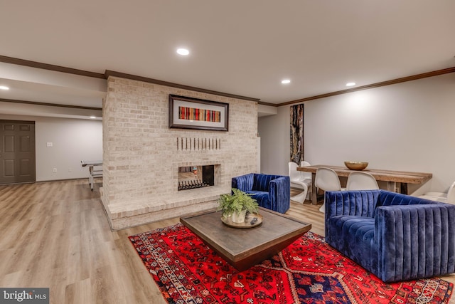8 Rockland Vue Ct, Towson, MD 21204 - living area featuring crown molding, wood finished floors, recessed lighting, and a brick fireplace