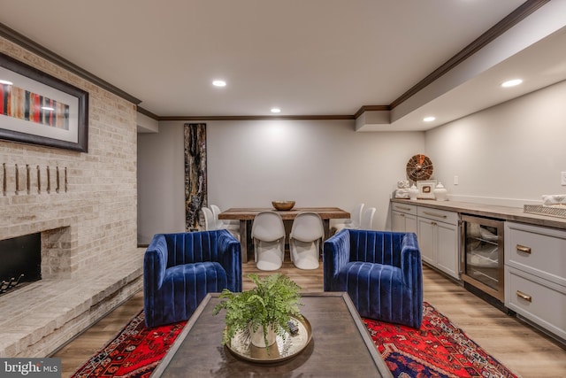 8 Rockland Vue Ct, Towson, MD 21204 - living room featuring crown molding, beverage cooler, light wood finished floors, a bar, and recessed lighting