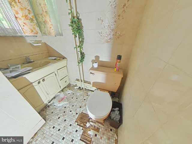 1620 S Broad St, Philadelphia, PA 19145 - bathroom with tile walls, vanity, and tile patterned flooring