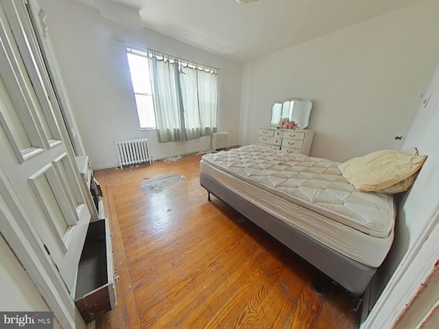 1620 S Broad St, Philadelphia, PA 19145 - bedroom with radiator heating unit and wood finished floors