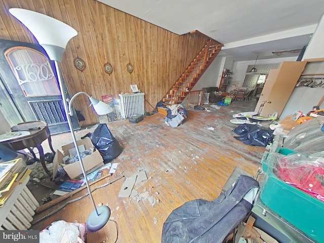 1620 S Broad St, Philadelphia, PA 19145 - living room with wood walls, stairs, and wood-type flooring