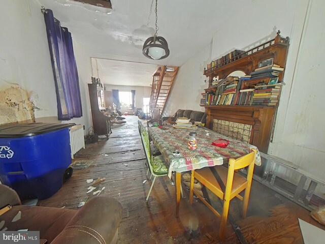 1620 S Broad St, Philadelphia, PA 19145 - dining area featuring radiator heating unit and wood-type flooring