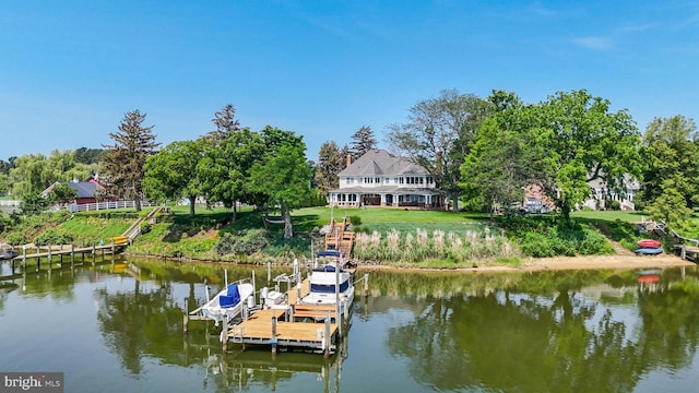 3950 Island Crk, Broomes Island, MD 20615 - dock area with a water view, boat lift, a lawn, and view of scattered trees