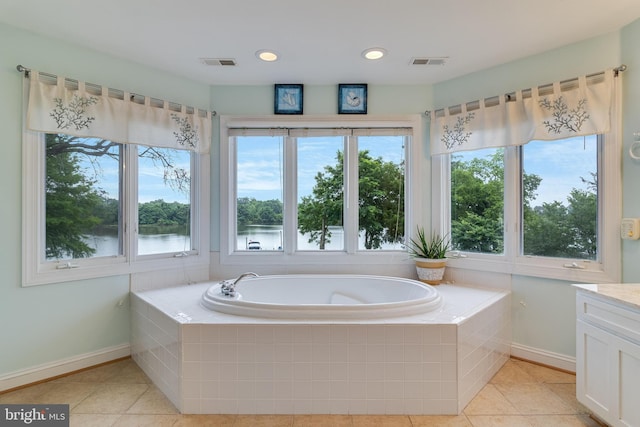 3950 Island Crk, Broomes Island, MD 20615 - bathroom featuring tile patterned floors, a bath, vanity, a water view, and recessed lighting