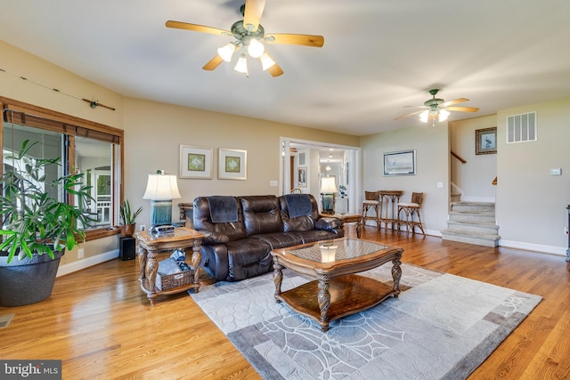3950 Island Crk, Broomes Island, MD 20615 - living room featuring a ceiling fan, stairway, and wood finished floors