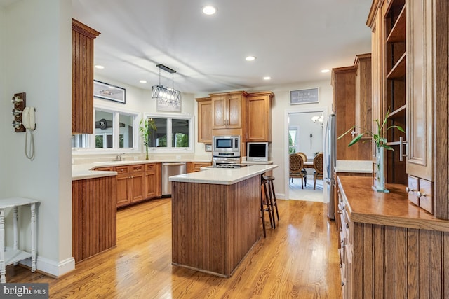 3950 Island Crk, Broomes Island, MD 20615 - kitchen with appliances with stainless steel finishes, open shelves, brown cabinetry, light wood-style floors, and recessed lighting
