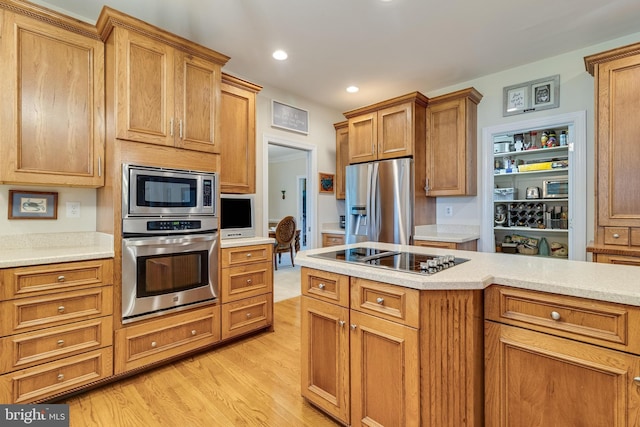 3950 Island Crk, Broomes Island, MD 20615 - kitchen featuring appliances with stainless steel finishes, light wood-type flooring, light countertops, recessed lighting, and brown cabinetry