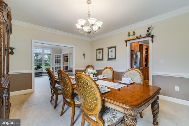 3950 Island Crk, Broomes Island, MD 20615 - dining room featuring a chandelier, ornamental molding, light colored carpet, and french doors