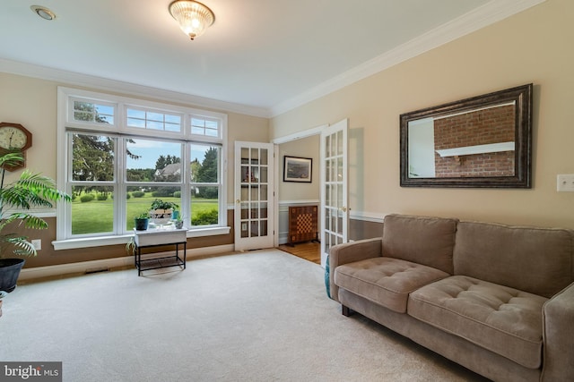 3950 Island Crk, Broomes Island, MD 20615 - living room featuring french doors, ornamental molding, and carpet flooring