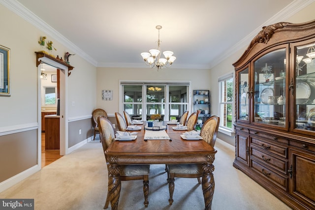 3950 Island Crk, Broomes Island, MD 20615 - dining area with light carpet, a chandelier, and ornamental molding