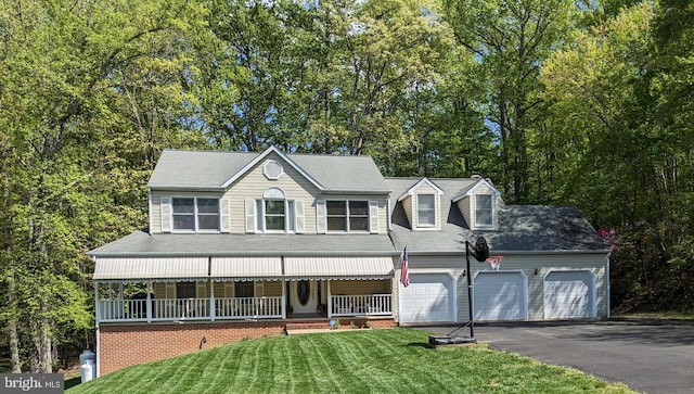 5 Alvin Ct, Stafford, VA 22556 - view of front facade featuring a porch, asphalt driveway, a front yard, an attached garage, and view of scattered trees