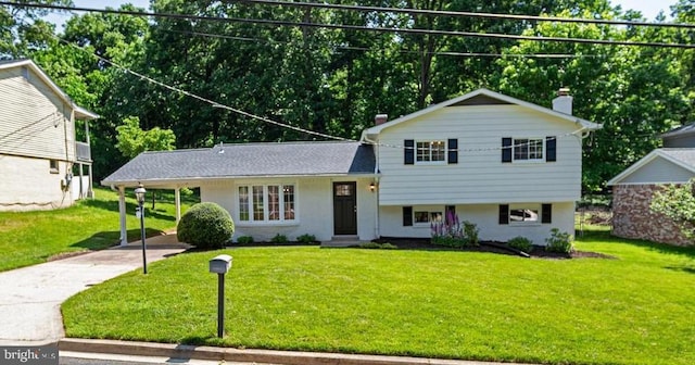 704 Kings Ln, Fort Washington, MD 20744 - split level home with driveway, a front lawn, a chimney, and a carport