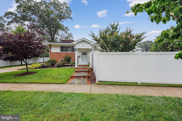 11218 Monticello Ave, Silver Spring, MD 20902 - view of front facade featuring brick siding and a chimney