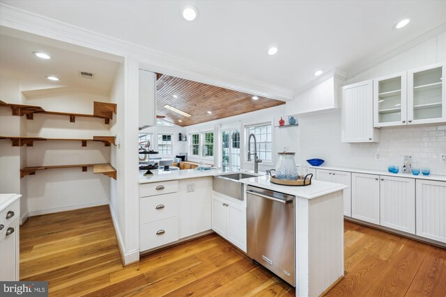 11218 Monticello Ave, Silver Spring, MD 20902 - kitchen featuring stainless steel dishwasher, lofted ceiling, ornamental molding, light countertops, and decorative backsplash