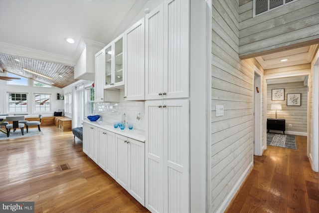 11218 Monticello Ave, Silver Spring, MD 20902 - hall featuring light wood-style floors, wood walls, and vaulted ceiling