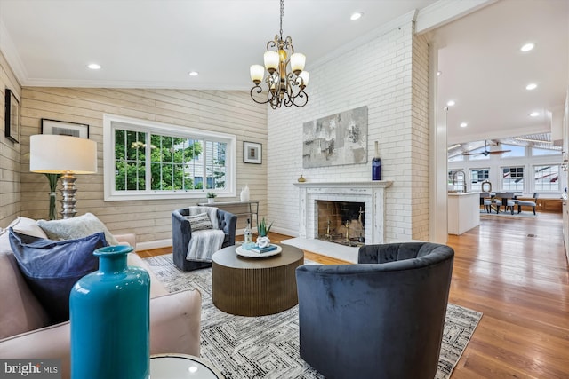 11218 Monticello Ave, Silver Spring, MD 20902 - living area featuring crown molding, wood finished floors, a brick fireplace, a chandelier, and wood walls