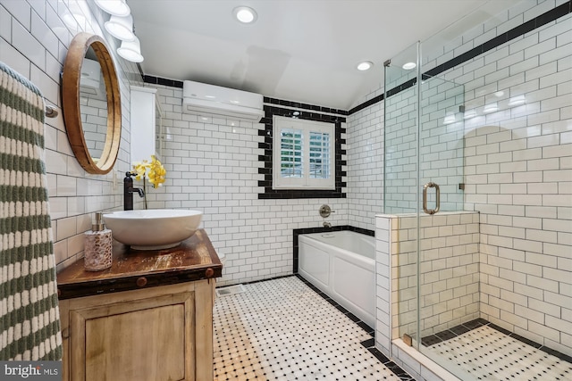 11218 Monticello Ave, Silver Spring, MD 20902 - full bathroom with tile walls, a bath, a stall shower, vanity, and recessed lighting