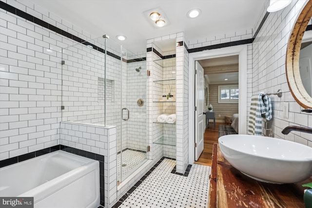 11218 Monticello Ave, Silver Spring, MD 20902 - full bathroom with tile walls, a bath, a shower stall, vanity, and recessed lighting