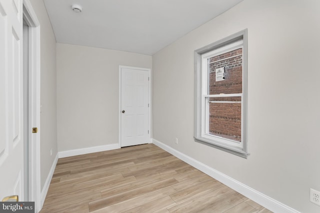 218 Sewell Ave, Hamilton, NJ 08610 - empty room with light wood finished floors, a smoke detector, and baseboards