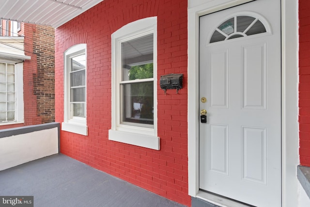 218 Sewell Ave, Hamilton, NJ 08610 - property entrance featuring covered porch and brick siding
