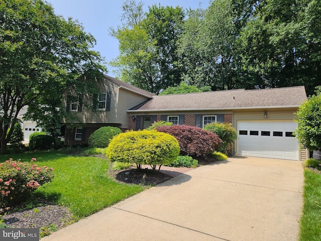 9528 Wallingford Dr, Burke, VA 22015 - split level home featuring driveway, a garage, a front yard, and brick siding