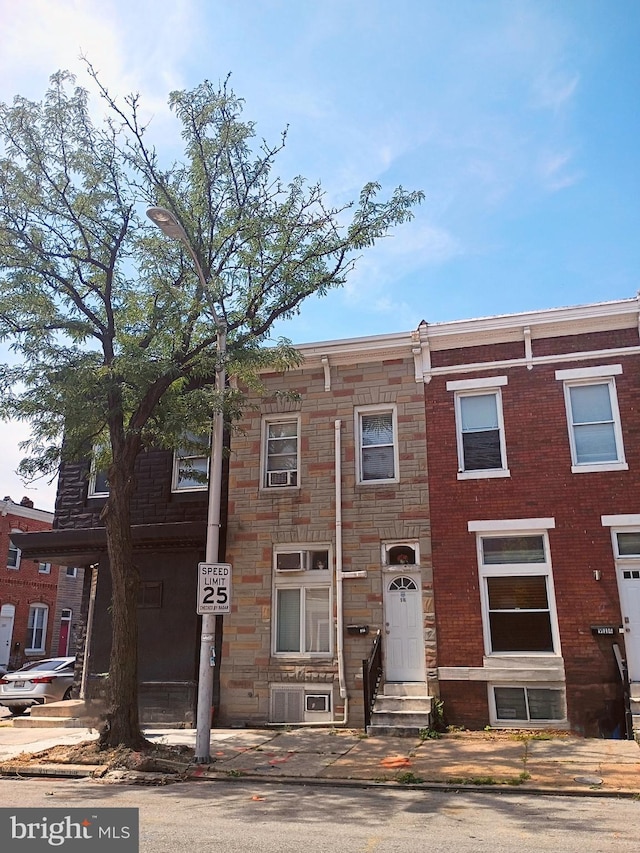916 S Carey St, Baltimore, MD 21223 - view of property with entry steps and stone siding