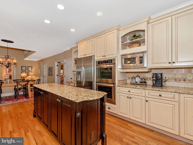 22324 Canterfield Way, Germantown, MD 20876 - kitchen featuring cream cabinetry, stainless steel appliances, backsplash, ornamental molding, and light wood-type flooring