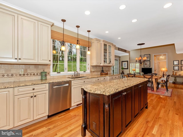 22324 Canterfield Way, Germantown, MD 20876 - kitchen featuring stainless steel dishwasher, cream cabinetry, a sink, decorative backsplash, and light wood-type flooring