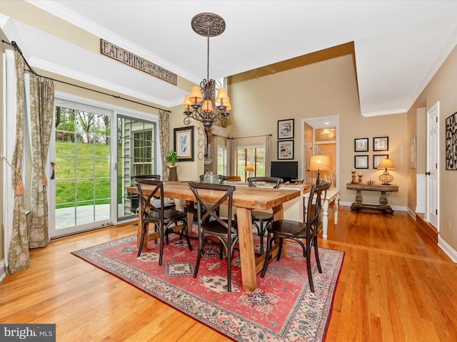 22324 Canterfield Way, Germantown, MD 20876 - dining space featuring a chandelier, plenty of natural light, light wood-style floors, baseboards, and crown molding