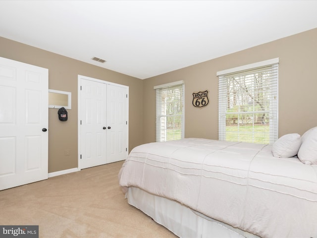 22324 Canterfield Way, Germantown, MD 20876 - bedroom with light carpet, a closet, and baseboards