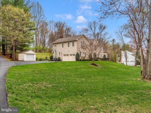 22324 Canterfield Way, Germantown, MD 20876 - view of front facade with a front lawn, an outbuilding, an attached garage, and asphalt driveway