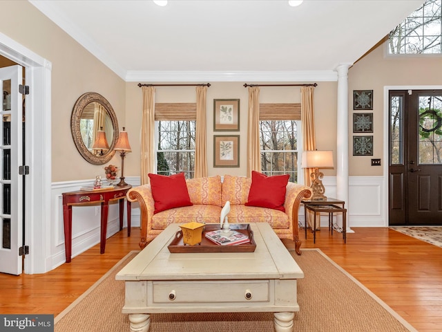 22324 Canterfield Way, Germantown, MD 20876 - living room with wood finished floors, healthy amount of natural light, a wainscoted wall, ornamental molding, and a decorative wall