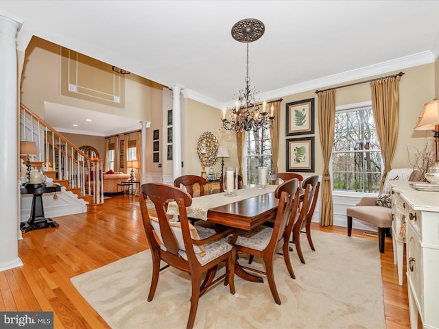 22324 Canterfield Way, Germantown, MD 20876 - dining room featuring crown molding, light wood-style flooring, a chandelier, and decorative columns