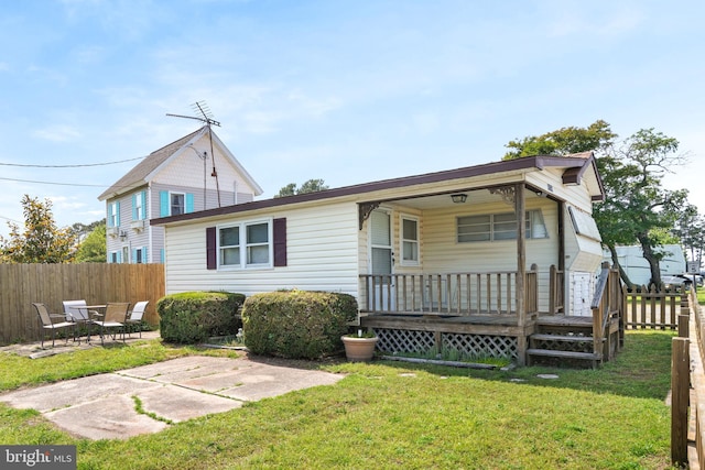 8096 Mire Pond One, Chincoteague Island, VA 23336 - view of front of property with a patio area and covered porch