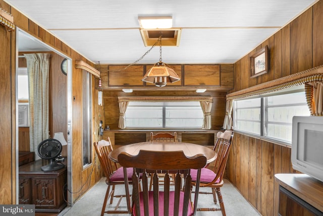 8096 Mire Pond One, Chincoteague Island, VA 23336 - dining area with wood walls and carpet