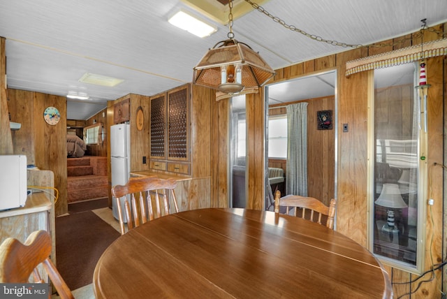 8096 Mire Pond One, Chincoteague Island, VA 23336 - dining area featuring wooden walls