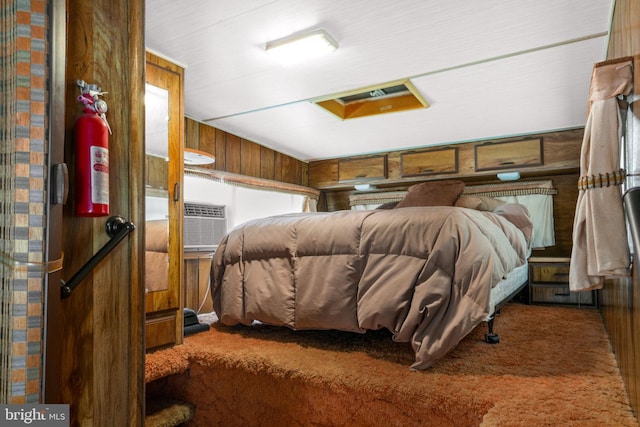 8096 Mire Pond One, Chincoteague Island, VA 23336 - bedroom with carpet floors and wood walls