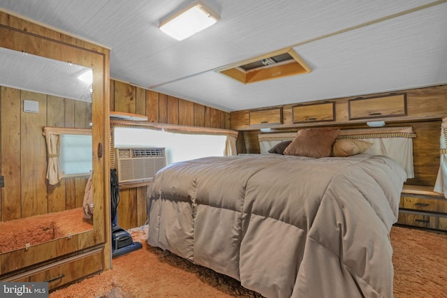 8096 Mire Pond One, Chincoteague Island, VA 23336 - carpeted bedroom with wood walls and multiple windows