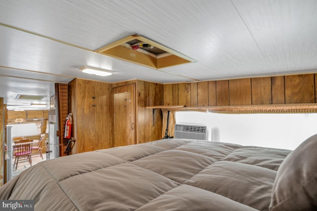 8096 Mire Pond One, Chincoteague Island, VA 23336 - bedroom with a wall mounted AC and wood walls